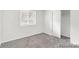 Bedroom featuring neutral walls, carpet, and a window at 1723 Robb St # 44, Lakewood, CO 80215