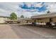 Outdoor covered carport parking for residents with a view of the surrounding apartment buildings at 1723 Robb St # 44, Lakewood, CO 80215