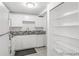 Updated kitchen featuring white cabinets, granite countertops, and stainless steel sink at 1723 Robb St # 44, Lakewood, CO 80215