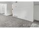 Open living room with carpet, fresh paint, and new window at 1723 Robb St # 44, Lakewood, CO 80215