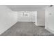 Bright, empty living room with carpet, a ceiling fan, and fresh white paint at 1723 Robb St # 44, Lakewood, CO 80215