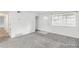 Sunny living room with carpet, fresh paint, and new window at 1723 Robb St # 44, Lakewood, CO 80215