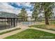 Fenced pool with community pool house in the middle of apartment buildings at 1723 Robb St # 44, Lakewood, CO 80215