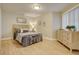 Cozy bedroom with light flooring and large dresser at 5690 W 80Th Pl # 91, Arvada, CO 80003