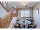 Charming dining area with hardwood floors and a round table at 5690 W 80Th Pl # 91, Arvada, CO 80003