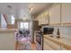 Modern kitchen with stainless steel appliances and breakfast nook at 5690 W 80Th Pl # 91, Arvada, CO 80003