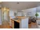 Open kitchen with double sink and views to the living room at 5690 W 80Th Pl # 91, Arvada, CO 80003