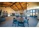 Community room with fireplace, seating and tables for residents to enjoy at 8740 Big Thompson St, Littleton, CO 80125