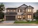 Beautiful two-story home featuring stone accents, a covered entry, and a two-car garage, perfect for a Gathering at 8740 Big Thompson St, Littleton, CO 80125