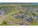 An elevated view shows the home in relation to the surrounding neighborhood, roads, and landscape at 228 Rogers Ct, Castle Rock, CO 80104