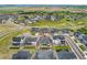 An aerial view shows a landscaped backyard, covered patio, and manicured front lawn at 228 Rogers Ct, Castle Rock, CO 80104