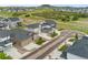 An aerial shot showcases a neighborhood with houses and well-maintained landscaping at 228 Rogers Ct, Castle Rock, CO 80104