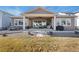 Large, covered back porch for entertaining with built in grill, seating and dining areas at 228 Rogers Ct, Castle Rock, CO 80104