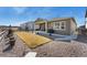 Well maintained back yard with a covered patio and a lush lawn at 228 Rogers Ct, Castle Rock, CO 80104