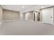 Spacious basement with neutral carpet and paint plus recessed lighting and stair access at 228 Rogers Ct, Castle Rock, CO 80104