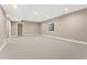 Unfinished basement with neutral carpet and a small window for natural light at 228 Rogers Ct, Castle Rock, CO 80104