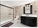 Beautiful bathroom with black fixtures and a glass shower with a built-in seat at 228 Rogers Ct, Castle Rock, CO 80104