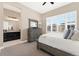 Relaxing bedroom adjacent to the bathroom, with a large window bringing in ample natural light at 228 Rogers Ct, Castle Rock, CO 80104
