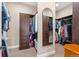 A closet with wood cabinets and shelving, offering ample storage space at 228 Rogers Ct, Castle Rock, CO 80104