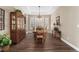 Traditional dining room with wood table, china cabinet and wainscoting at 228 Rogers Ct, Castle Rock, CO 80104