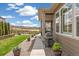 Backyard view featuring a grill and patio area with lush greenery and privacy fencing at 228 Rogers Ct, Castle Rock, CO 80104