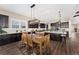 A kitchen with an adjacent dining area features an island and wood table with 6 chairs at 228 Rogers Ct, Castle Rock, CO 80104