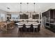 Gourmet kitchen featuring an expansive island with seating, stainless steel appliances, and dark wood cabinetry at 228 Rogers Ct, Castle Rock, CO 80104