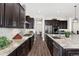 Open kitchen with stainless steel appliances, granite countertops, and tile backsplash at 228 Rogers Ct, Castle Rock, CO 80104