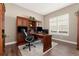 Home office with custom cabinets, a built-in desk, and a plush rug at 228 Rogers Ct, Castle Rock, CO 80104