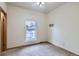 Bright bedroom featuring a ceiling fan, large window, and neutral paint, ready for personalized touches at 7971 Larkspur Cir # 219, Frederick, CO 80530