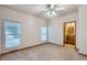Bedroom with carpet, natural light, and an ensuite bathroom with a wood vanity at 7971 Larkspur Cir # 219, Frederick, CO 80530