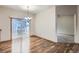 Dining room with hardwood floors and sliding glass doors leading to a patio at 7971 Larkspur Cir # 219, Frederick, CO 80530