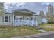 Lovely one-story home with covered porch, white trim, and well-kept lawn and landscape at 7971 Larkspur Cir # 219, Frederick, CO 80530