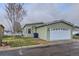 Charming home featuring a two-car garage, manicured lawn, and lovely landscaping for curb appeal at 7971 Larkspur Cir # 219, Frederick, CO 80530