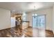 Inviting kitchen features wood floors, ample countertop space, white appliances, and bright lighting at 7971 Larkspur Cir # 219, Frederick, CO 80530