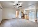 Bright, open living space showcasing neutral tones, wood floors, and easy access to the kitchen at 7971 Larkspur Cir # 219, Frederick, CO 80530