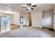 Open-concept floor plan featuring wood flooring, neutral carpet, and abundant natural light at 7971 Larkspur Cir # 219, Frederick, CO 80530