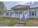 Charming exterior with a covered front porch, white railings, and meticulous landscaping at 7971 Larkspur Cir # 219, Frederick, CO 80530