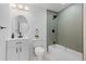 Updated bathroom features modern fixtures, a tub, and stylish tile in shower area at 3055 S Winona Ct, Denver, CO 80236