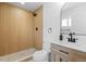 Bathroom with modern fixtures, tiled shower, and a stylish vanity with sink at 3055 S Winona Ct, Denver, CO 80236