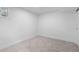 A bright, carpeted bedroom with white walls and trim at 3055 S Winona Ct, Denver, CO 80236