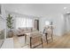 Inviting living room boasting lots of natural light, sleek light fixtures, and an updated fireplace at 3055 S Winona Ct, Denver, CO 80236