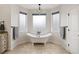 Charming bathroom features a clawfoot tub, tile floor, and natural light at 6071 S Detroit St, Centennial, CO 80121