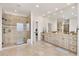 Large bathroom with double vanity, walk-in shower, and tile floors at 6071 S Detroit St, Centennial, CO 80121