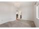 Bedroom with carpeting, chandelier, and view of en suite bathroom at 6071 S Detroit St, Centennial, CO 80121