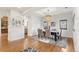 Dining room with hardwood floors, a tray ceiling, a chandelier, and an arched doorway at 6071 S Detroit St, Centennial, CO 80121