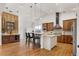 Spacious kitchen featuring wood cabinets, granite countertops, stainless steel appliances, and a center island at 6071 S Detroit St, Centennial, CO 80121