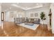 Open-concept living room with hardwood floors, recessed lighting, and a cozy seating arrangement at 6071 S Detroit St, Centennial, CO 80121