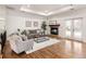 Living room featuring a brick fireplace, recessed lighting, and double doors to the backyard at 6071 S Detroit St, Centennial, CO 80121
