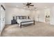 Bright main bedroom with ceiling fan and en suite bathroom at 6071 S Detroit St, Centennial, CO 80121